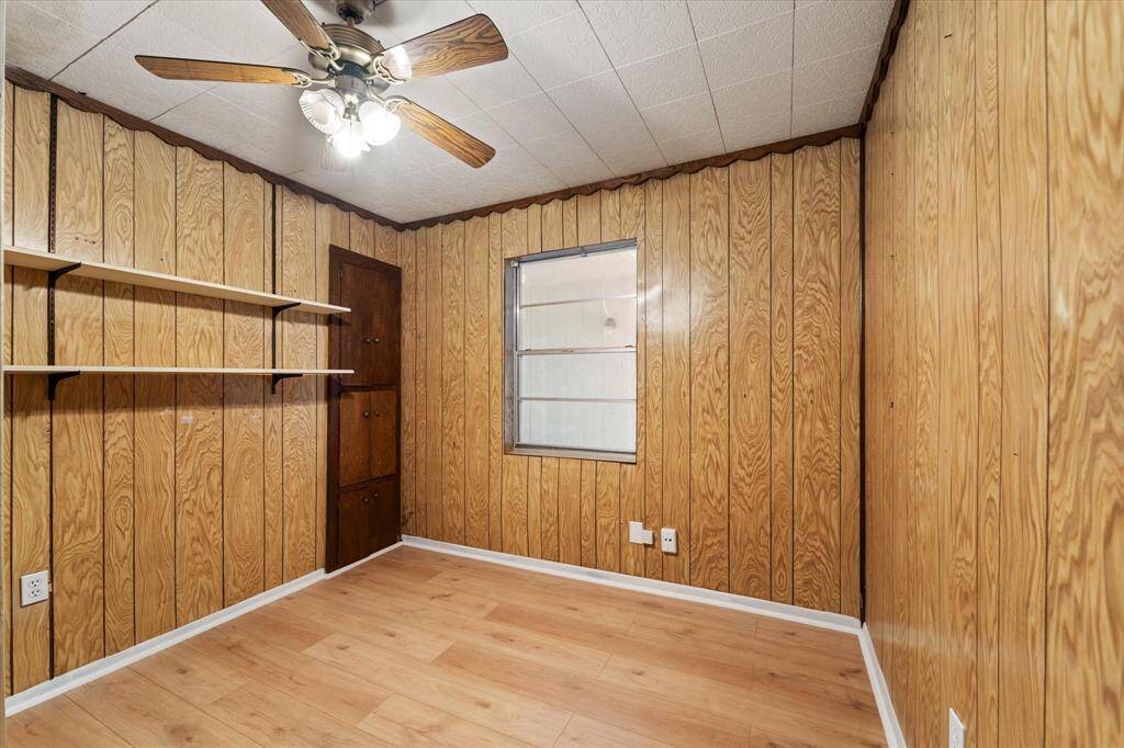 Bedroom two downstairs complete with built in desk and storage, ceiling fan and a roomy closet.