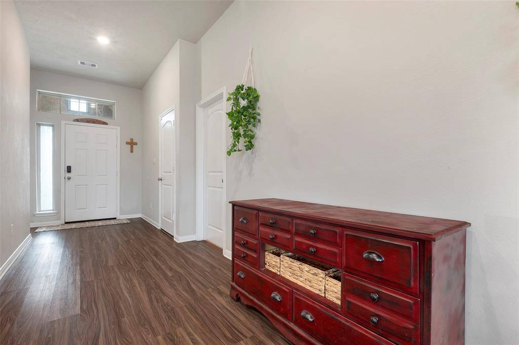 Bright open Foyer with access to Garage, Laundry and Front bedroom with en-suite bath