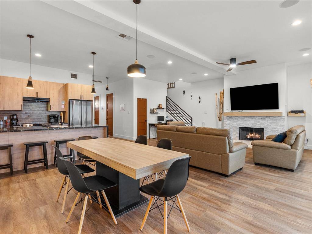 Modern dining area seamlessly connected to the open-concept kitchen and living room, perfect for entertaining.