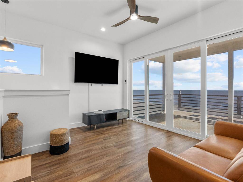 Bright and inviting upstairs living area with ocean views, perfect for relaxation or entertaining.