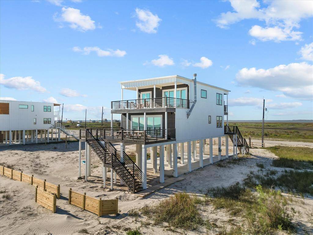 10614 Blue Water Hwy Discover coastal living at this stunning elevated home offers breathtaking views, modern design, and spacious outdoor decks perfect for relaxation. Embrace the beach lifestyle in this beautiful retreat.