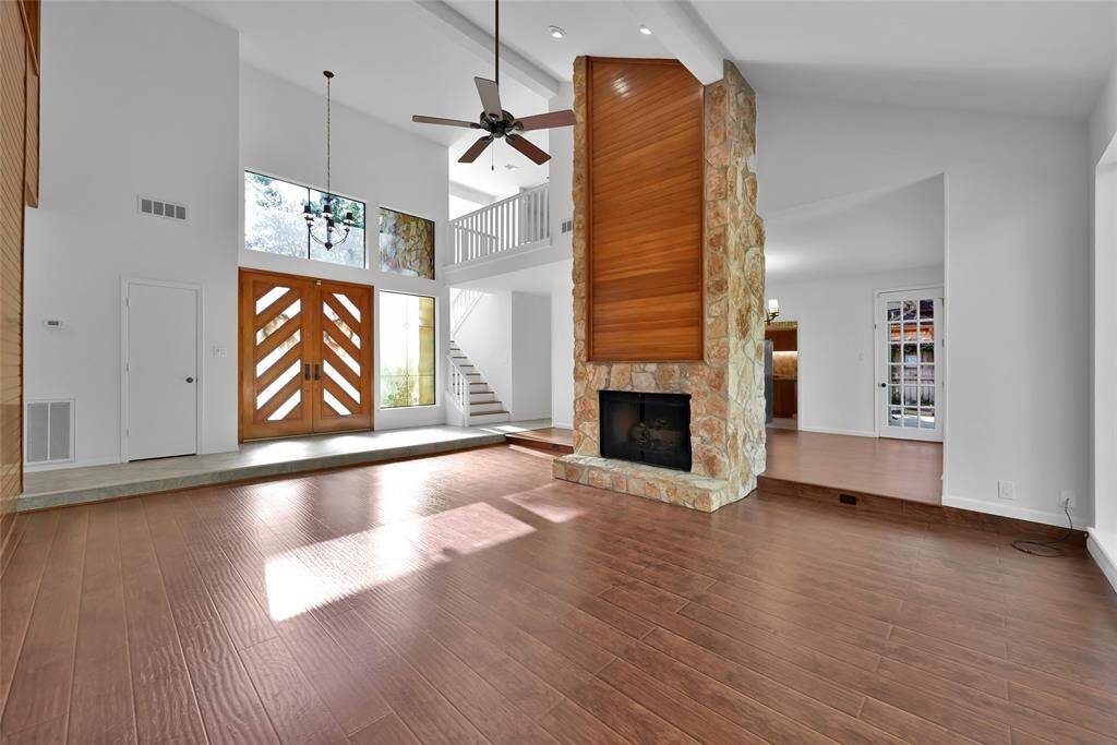 Two story fireplace creating a warm and inviting ambiance in the heart of the home.