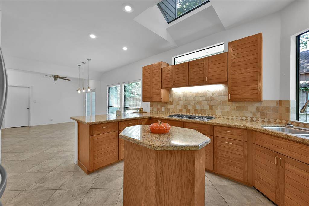 The kitchen opens up to the breakfast room, expanding the living space.