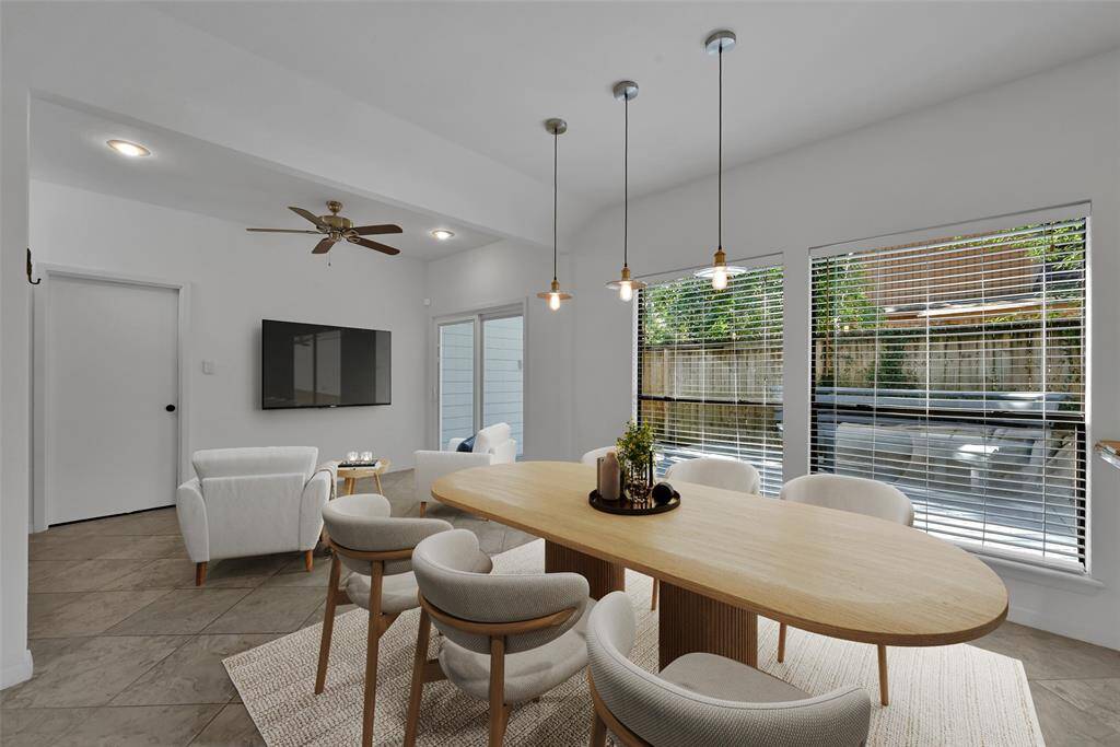 Virtually staged breakfast and living area in open concept kitchen