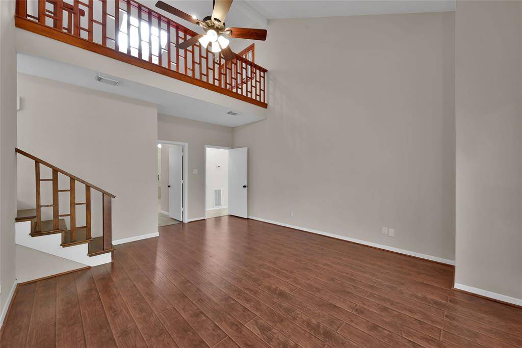 Extremely private two story primary suite offers an expansive space with high ceilings.