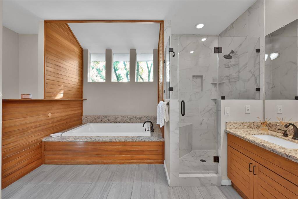 Gorgeous wood details throughout in the completely updated primary ensuite.