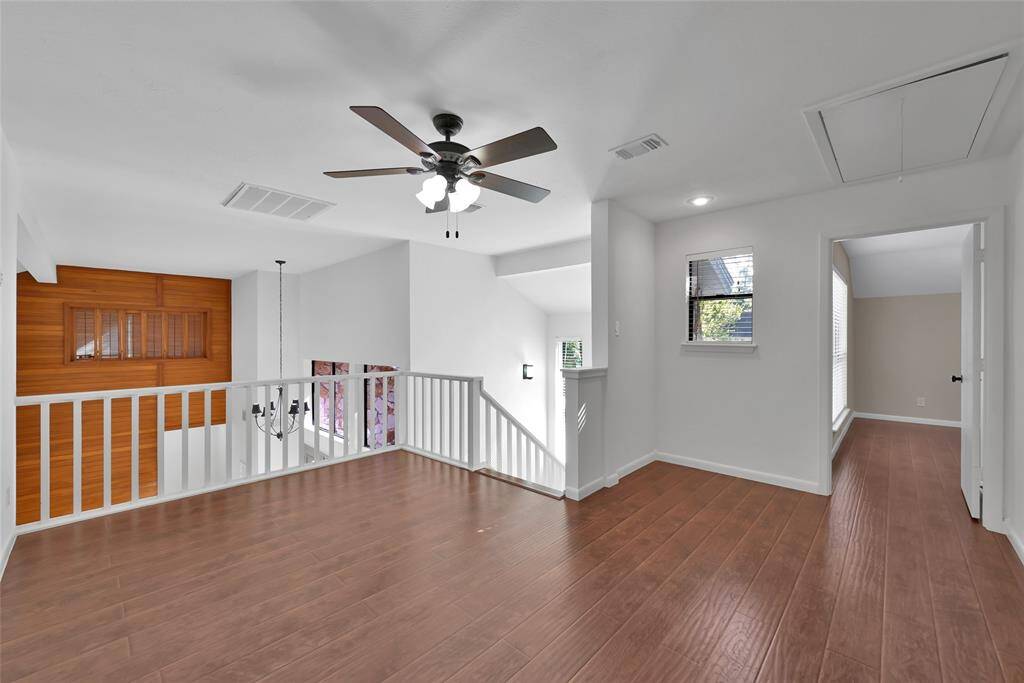 The natural light continues up the stairs in a perfect landing for games, study room, or tv room.
