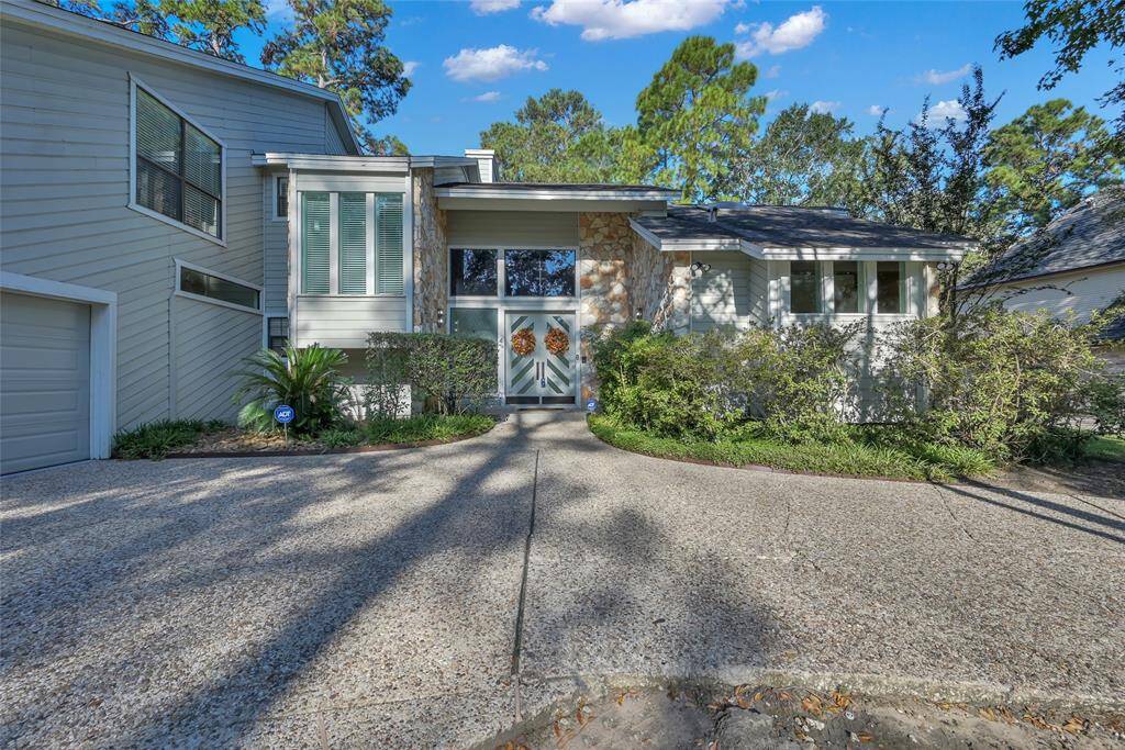 Two beautiful front doors and lots of windows allows natural light to flow through the front of the home.