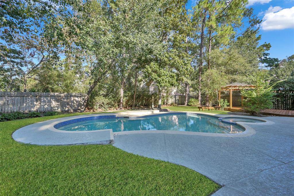 Enjoy this shaded and private sanctuary with a large pool and spa.