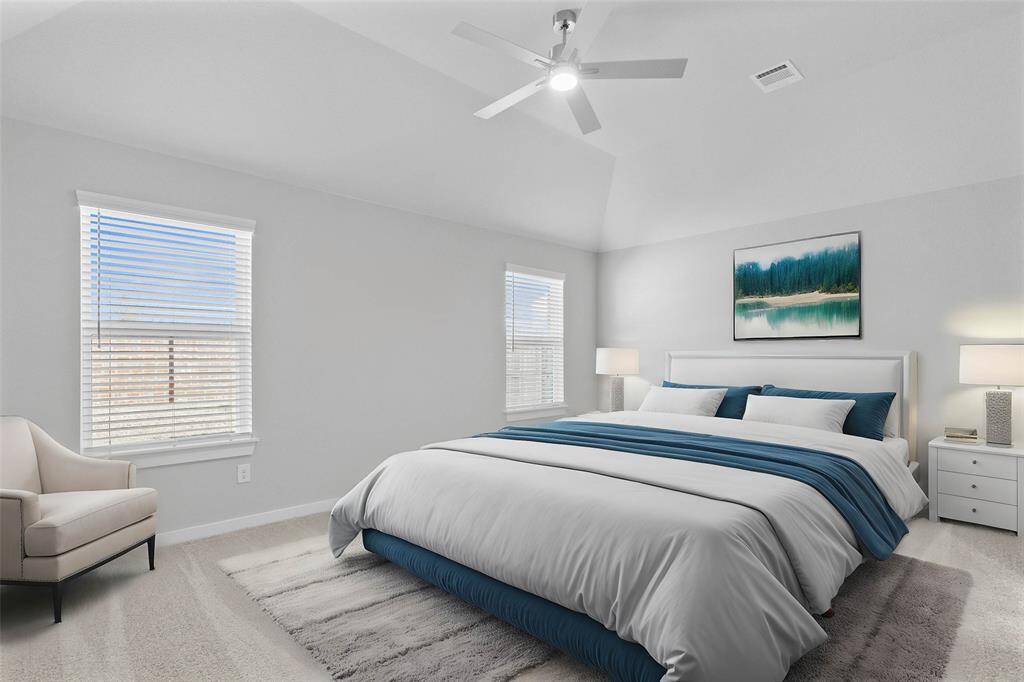 Come and unwind after a long day in this magnificent primary suite! This spacious room features plush carpet, custom neutral paint, high ceilings, ceiling fan and large windows with privacy blinds.
