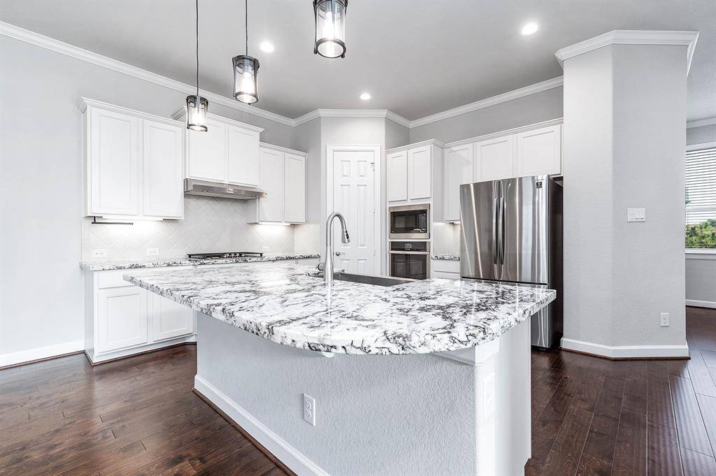 Gourmet kitchen with stainless steel appliances (refrigerator included) and plenty of pantry and cabinet space.