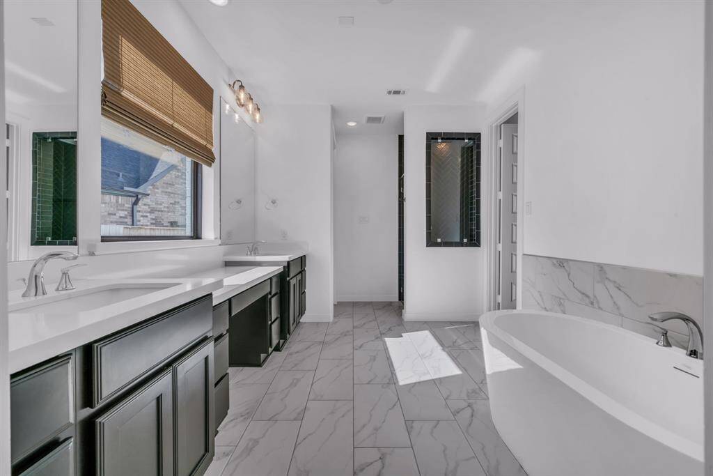 Primary bath boasts large soaking tub and oversized shower!