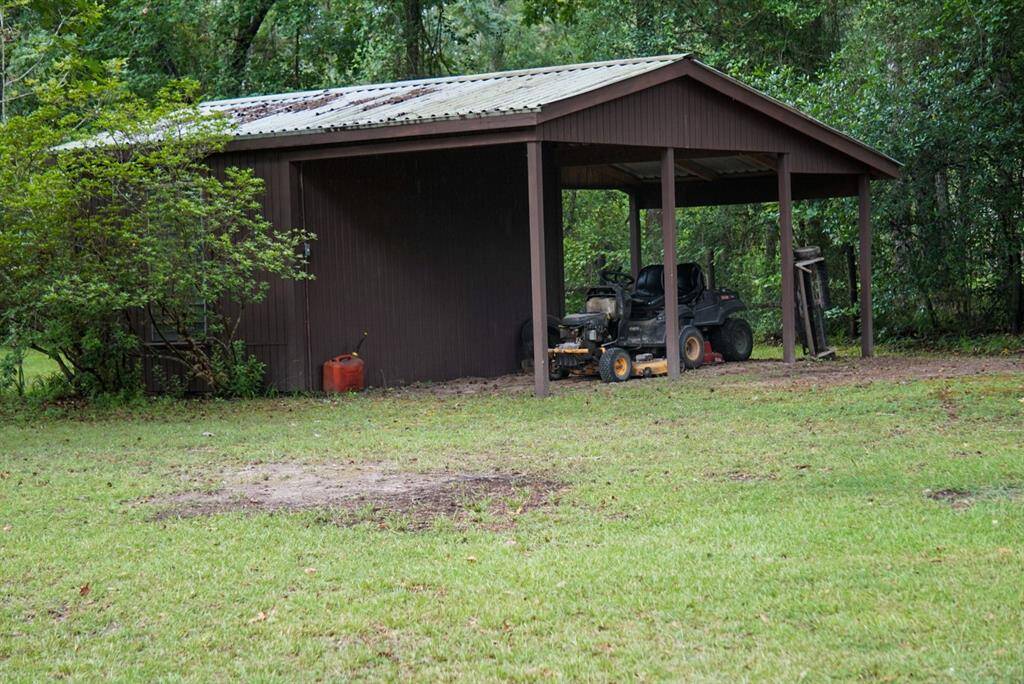 Extra Storage shed with covered parking.