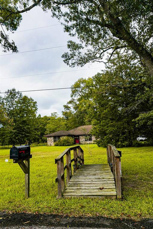 Wooden bridge leading to the mailbox.