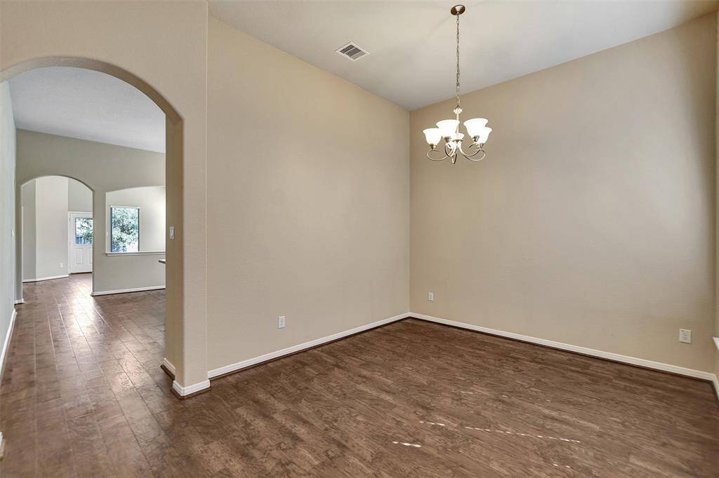 Wide entry into the formal dining or great for an office space