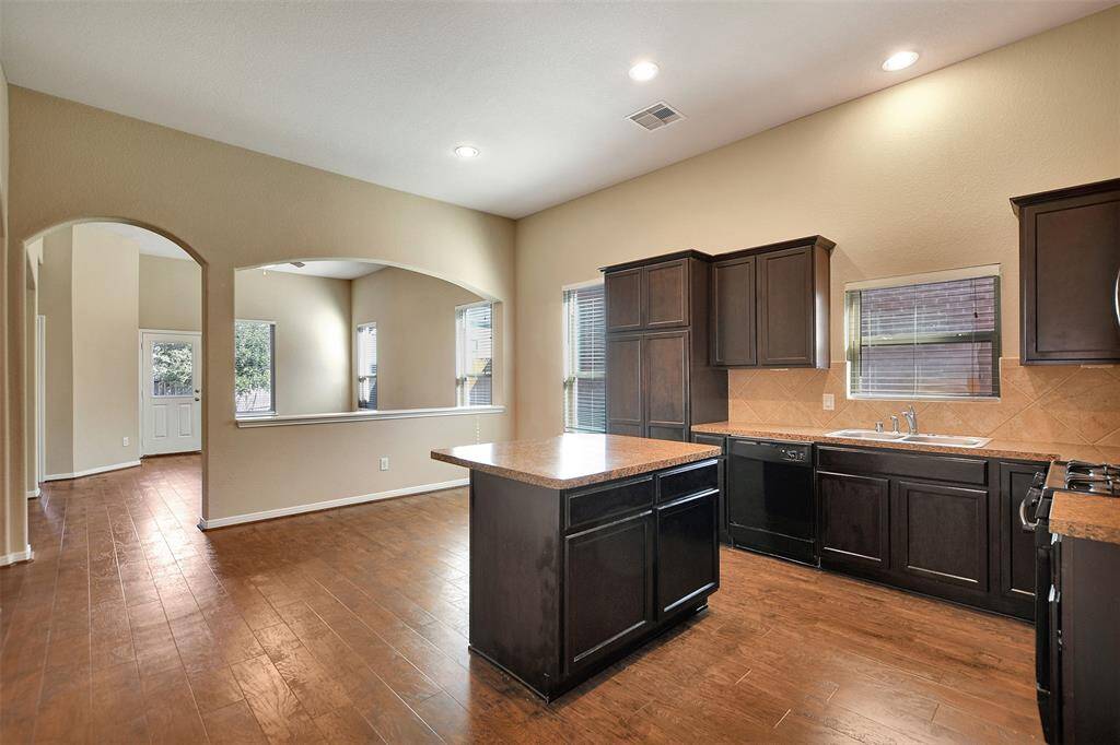 Virtually staged open kitchen and dining/breafast room