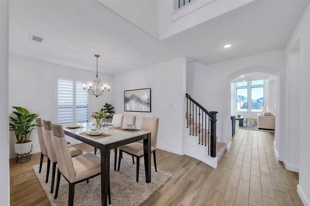 Formal dining space. Gorgeous wood like tile flows throughout!