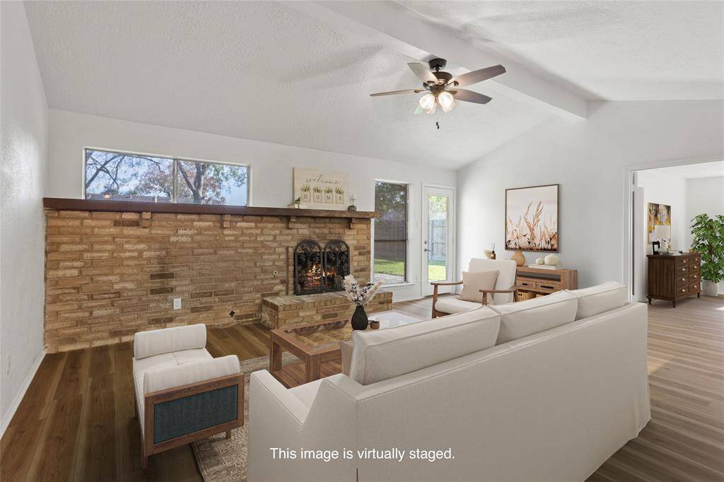 Beautiful living room with gas fireplace and vaulted ceiling.