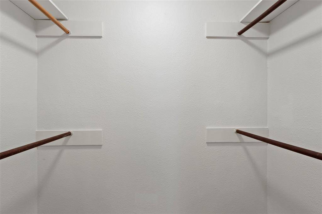 Walk-in closet for the primary suite.