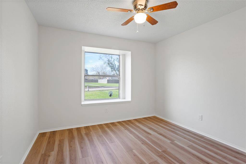 This primary bedroom faces the front of the home.