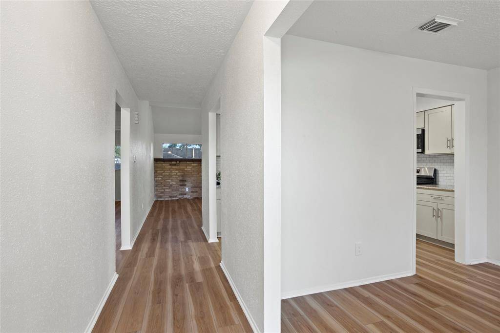 Come on in! To the right is the den / dining room / study. It's flexible for whatever you may need. Straight ahead is the living room.