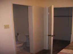Primary bed bathroom has 2 huge walk in closets and a built in cabinet for socks, shirts, and underwear