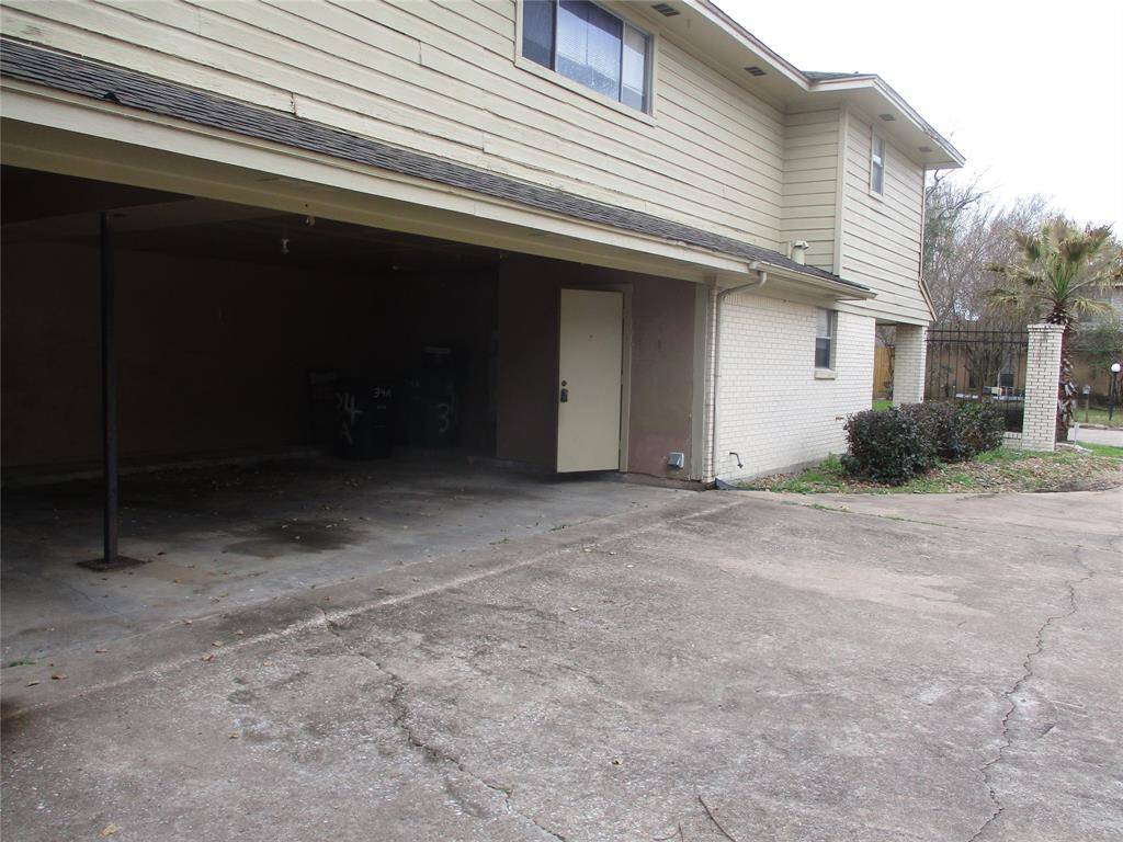 2 car carport for parking separates front from back unit