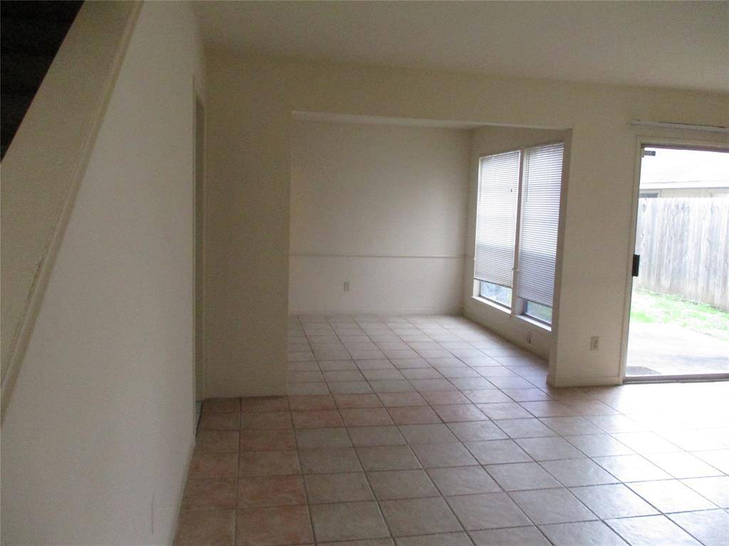 living room dining room area. storage under stairs as well