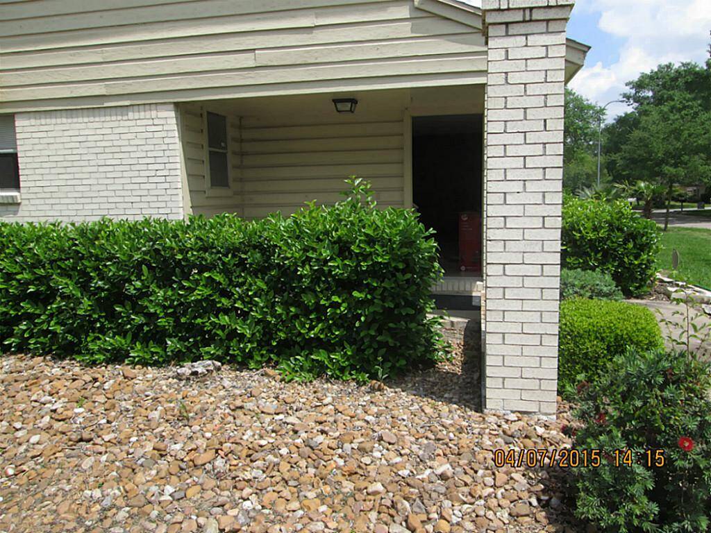 Covered main entry with room for a chair and tables.