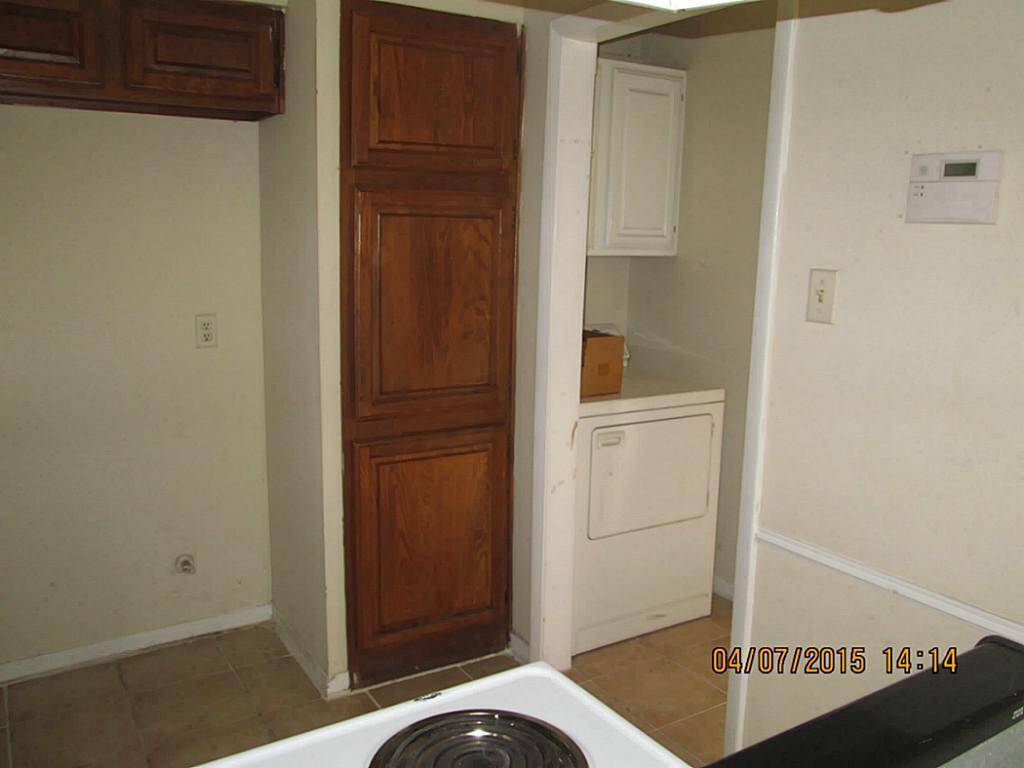 Nice walnut cabinets and woodwork throughout the property