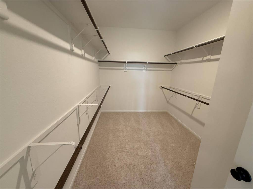 Large walk-in closet in primary suite