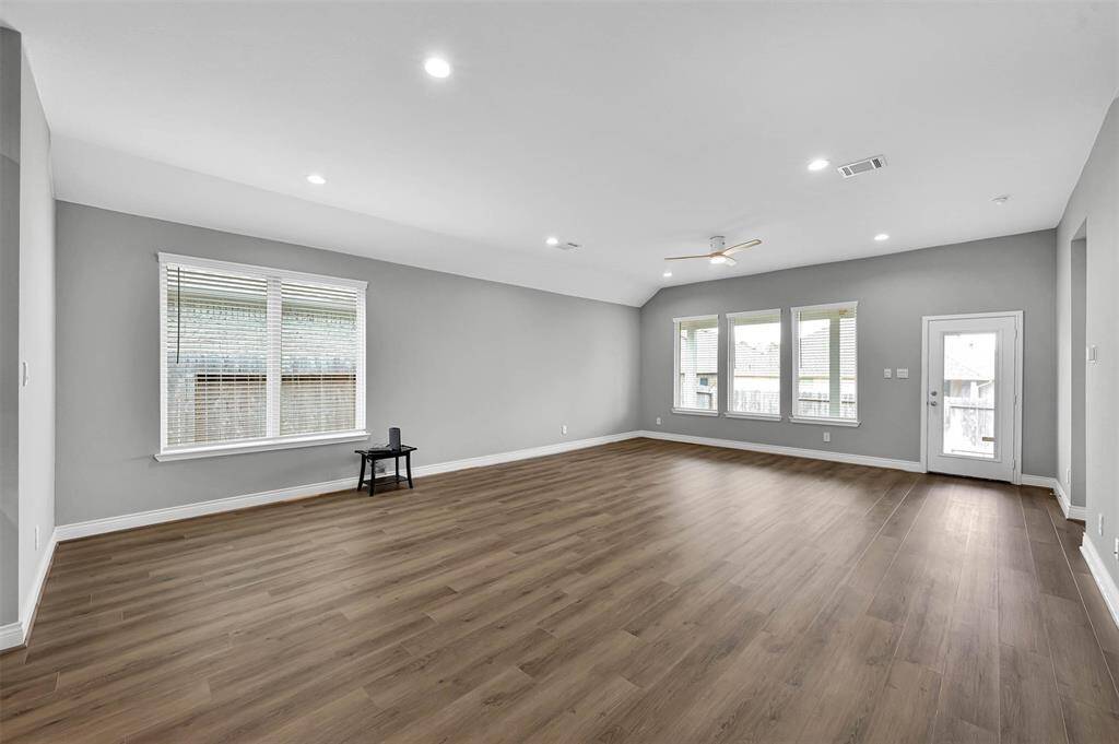 Dining and Living areas off the Kitchen loaded with natural light.