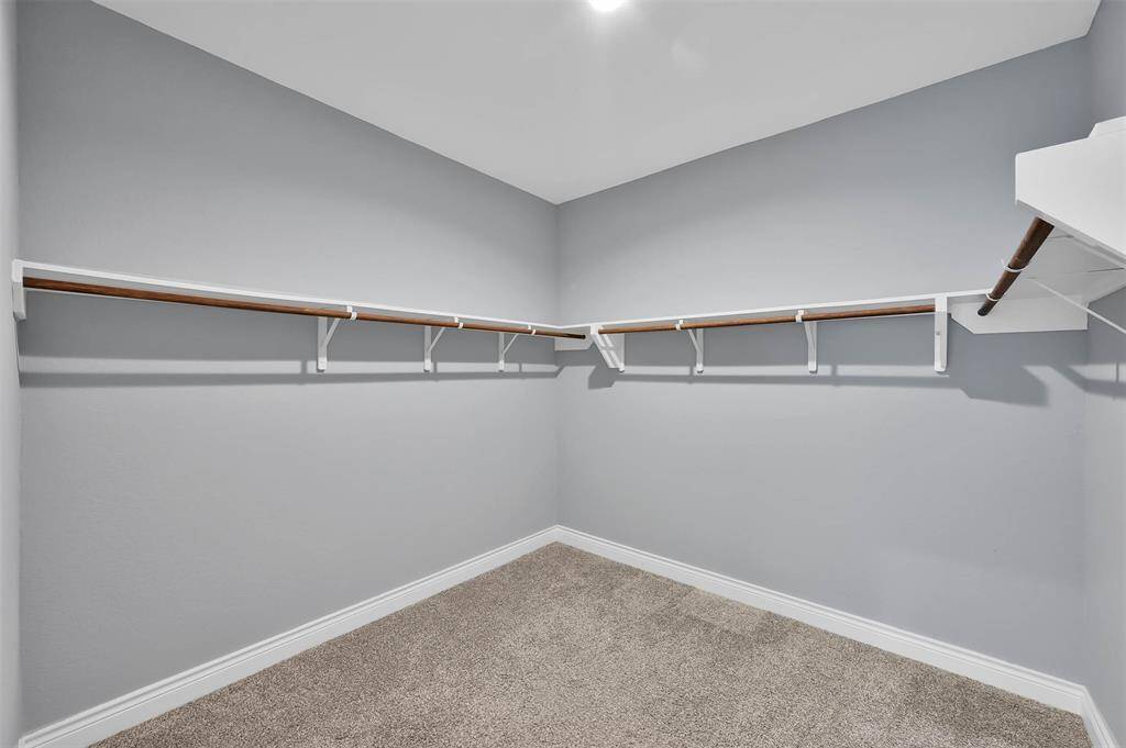 Create your own personal dressing room in this large Primary closet.