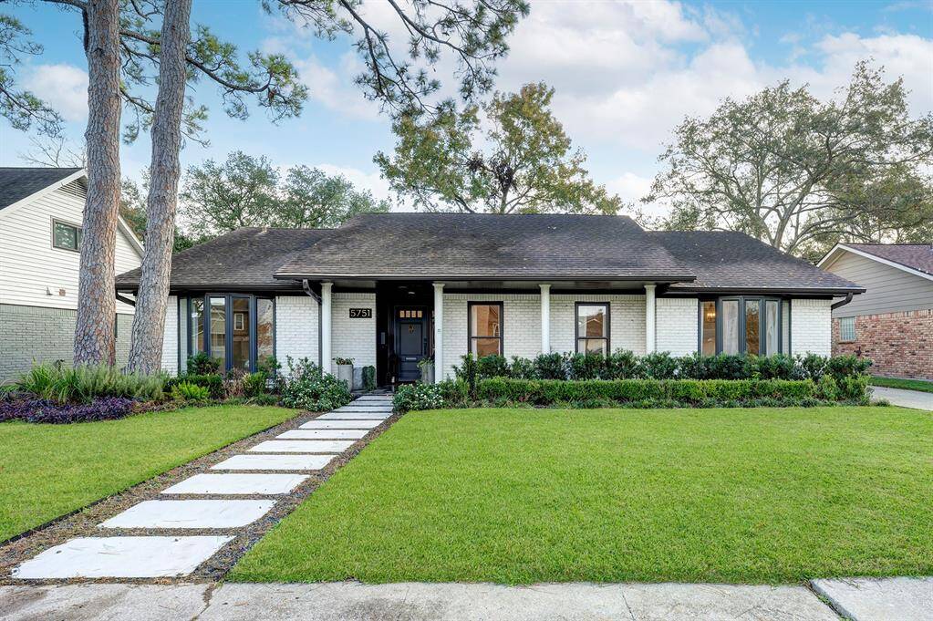 Charming exterior with crushed granite on the walkway and a front porch