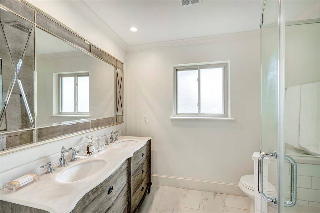 Laundry room (off the kitchen)has cabinets for storage and brooms, etc. counter for folding. Hanging rod. French door to garage driveway