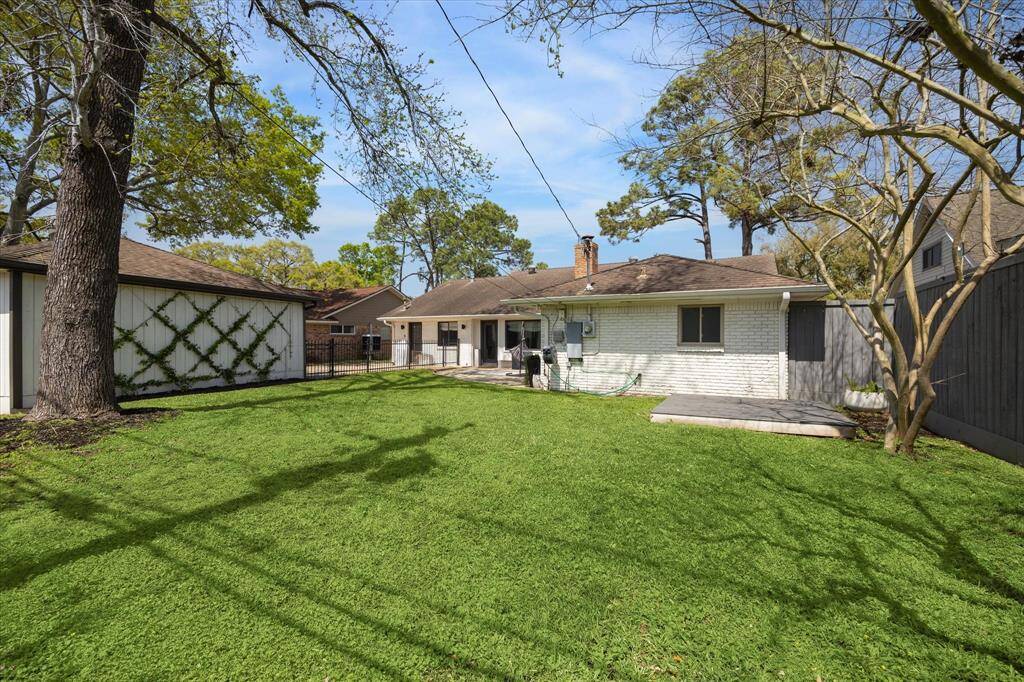 Backyard with a lot of green space. Create your own custom landscape