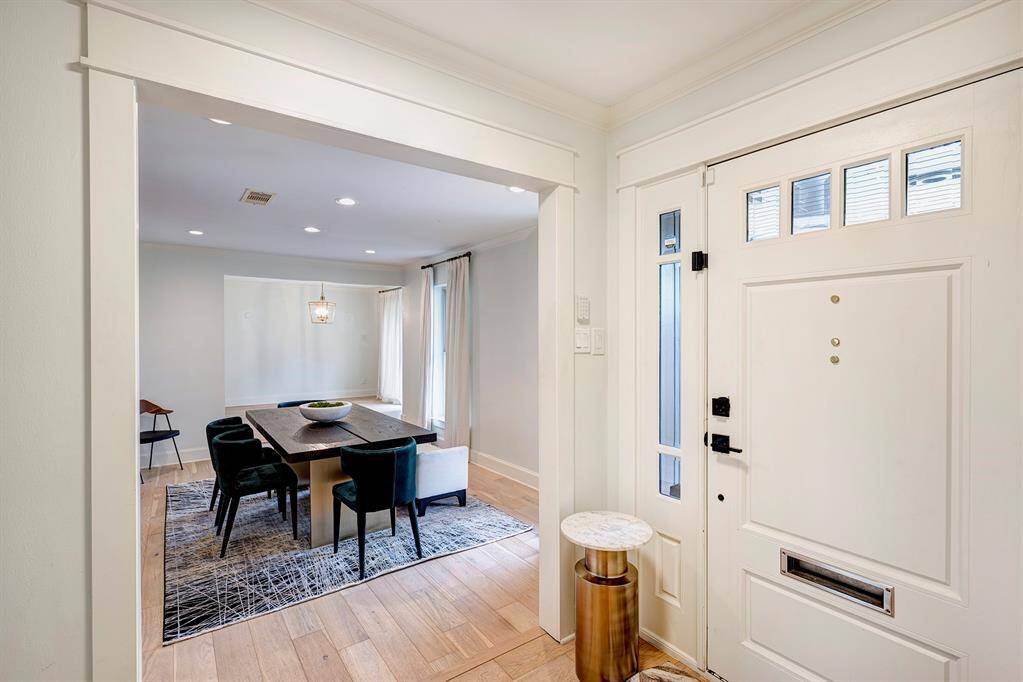 Through the front door crisp white walls and wood floors await.