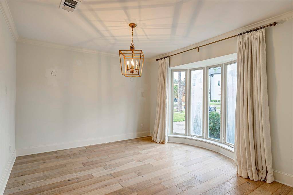 Den/Family Room has windows to the back  yard and a French door.