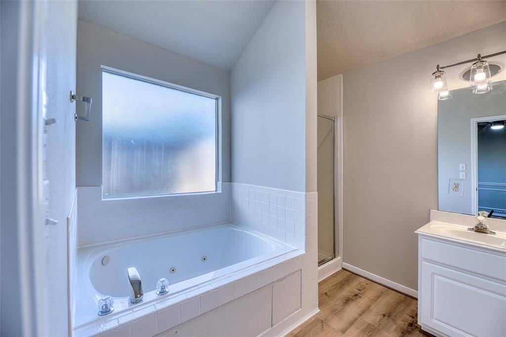 Luxurious soaking tub in the primary bath.