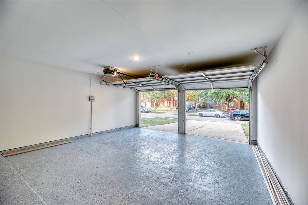 Spacious two-car garage with clean, freshly painted floors!