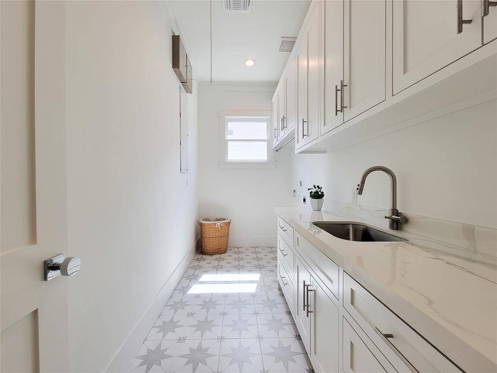 Laundry Room upstairs has plenty of storage for all your needs.
