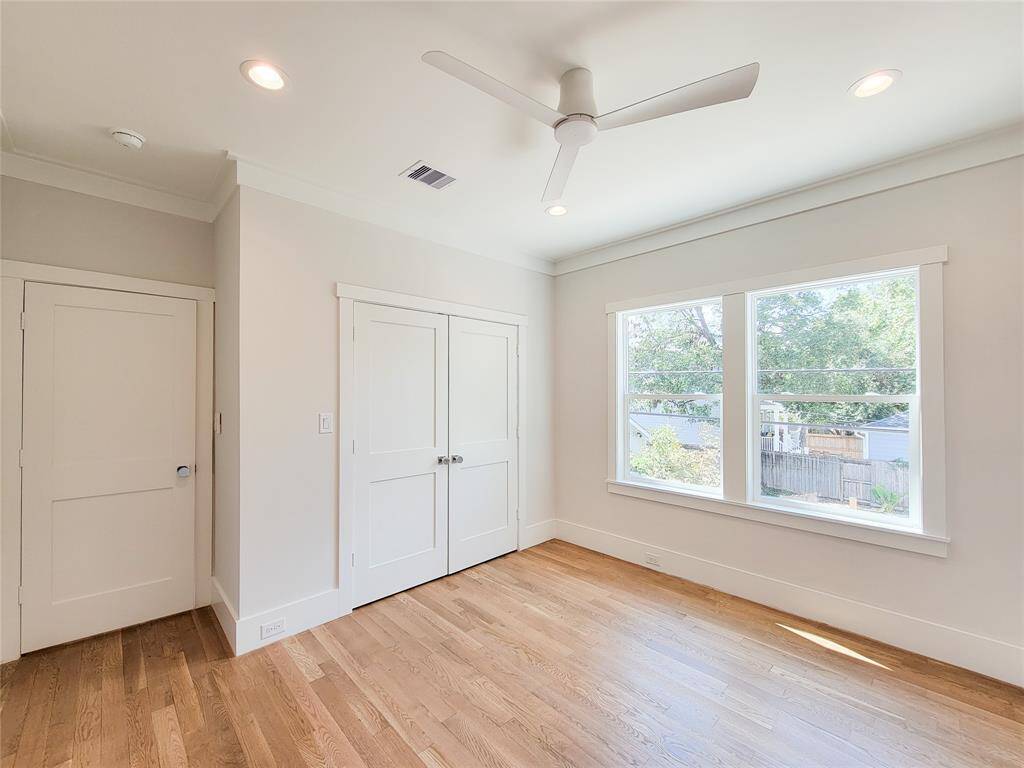 Bedroom in the garage apartment is filled with natural light, and a nice size closet.