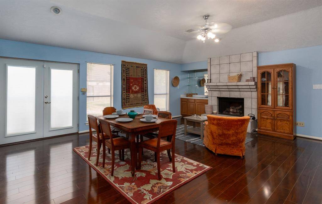 The expansive family also has access to the Texas Size backyard through these beautiful French doors with built in blinds. The area just outside these doors is a perfect location for BBQ'ing and bringing the indoors out.