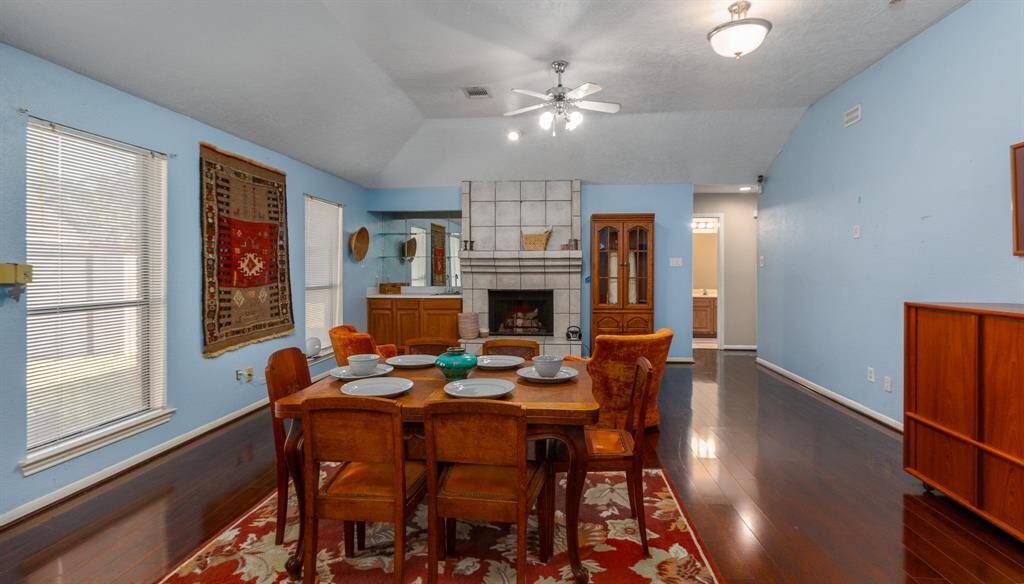Spacious dining area seamlessly connected to the family room, perfect for entertaining.