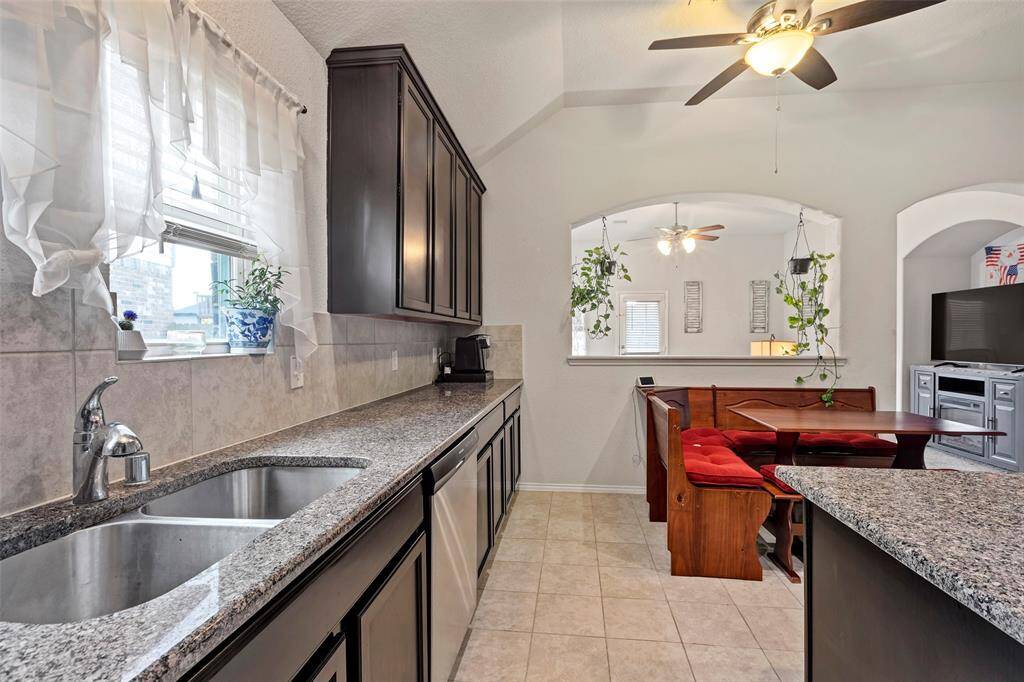An additional view of this cozy kitchen, featuring convenient double sinks for added functionality and ease.