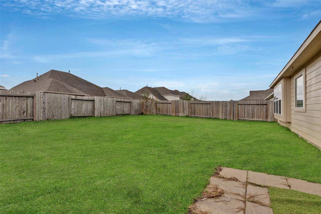 This spacious backyard is perfect for outdoor activities, family gatherings, or simply enjoying the fresh air.