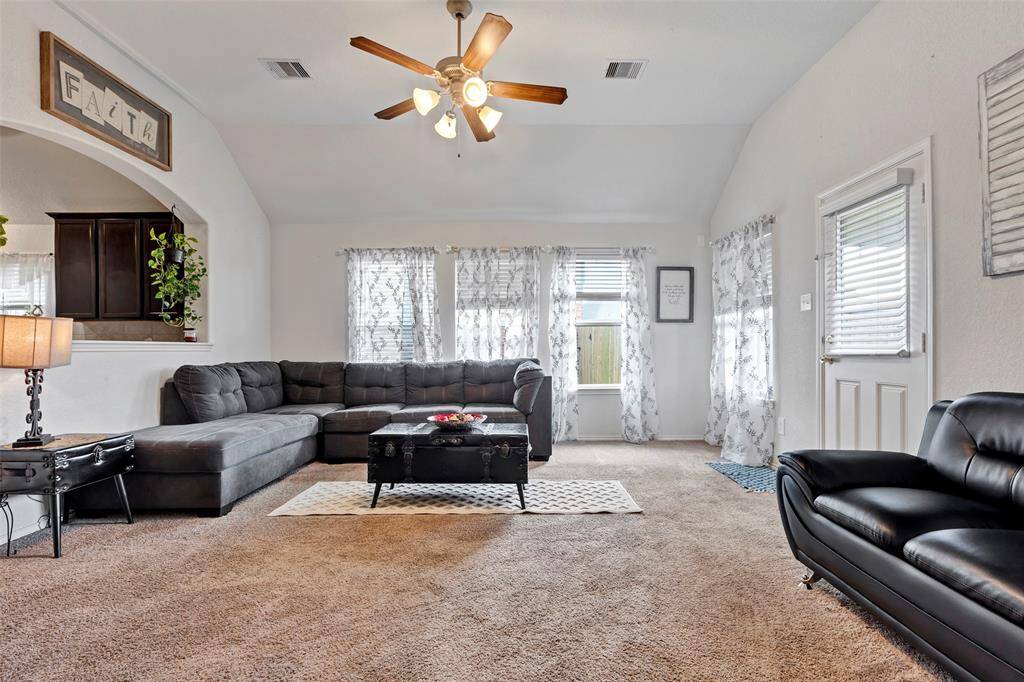 Flooded with natural light from expansive windows and featuring soaring high ceilings, this space feels open, airy, and full of possibilities.