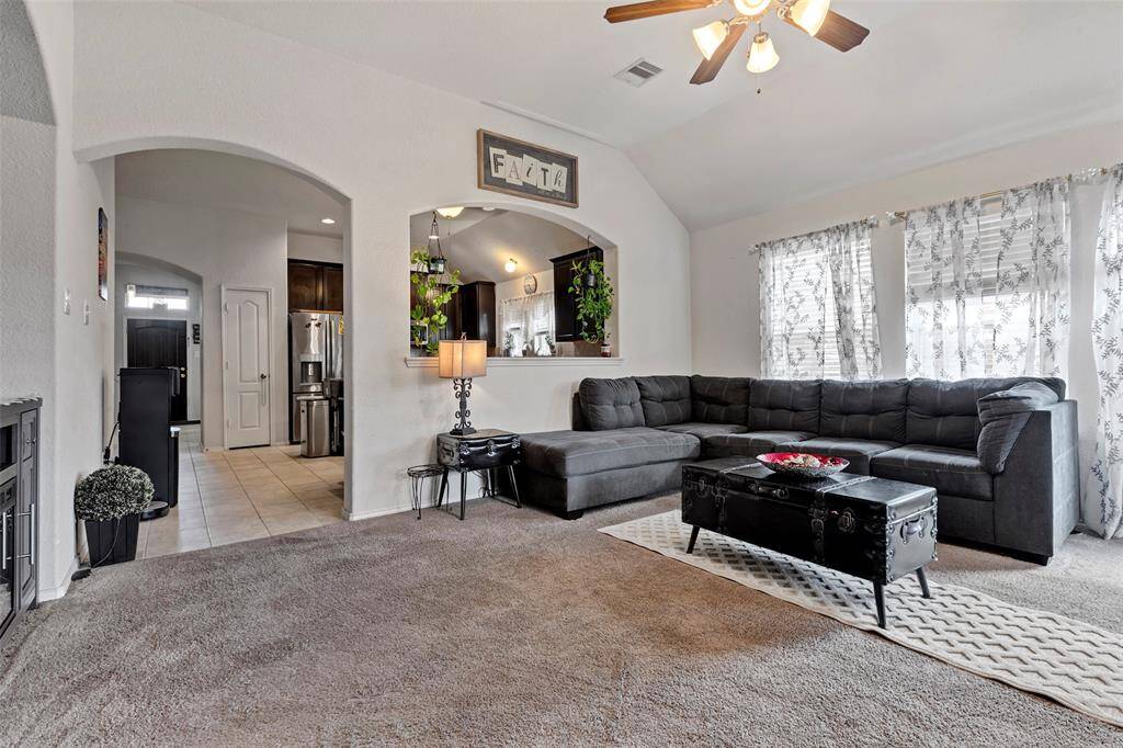 Conveniently located behind the living room, the kitchen features a partition with a window and a wide open door, seamlessly connecting the two spaces for easy flow and interaction.