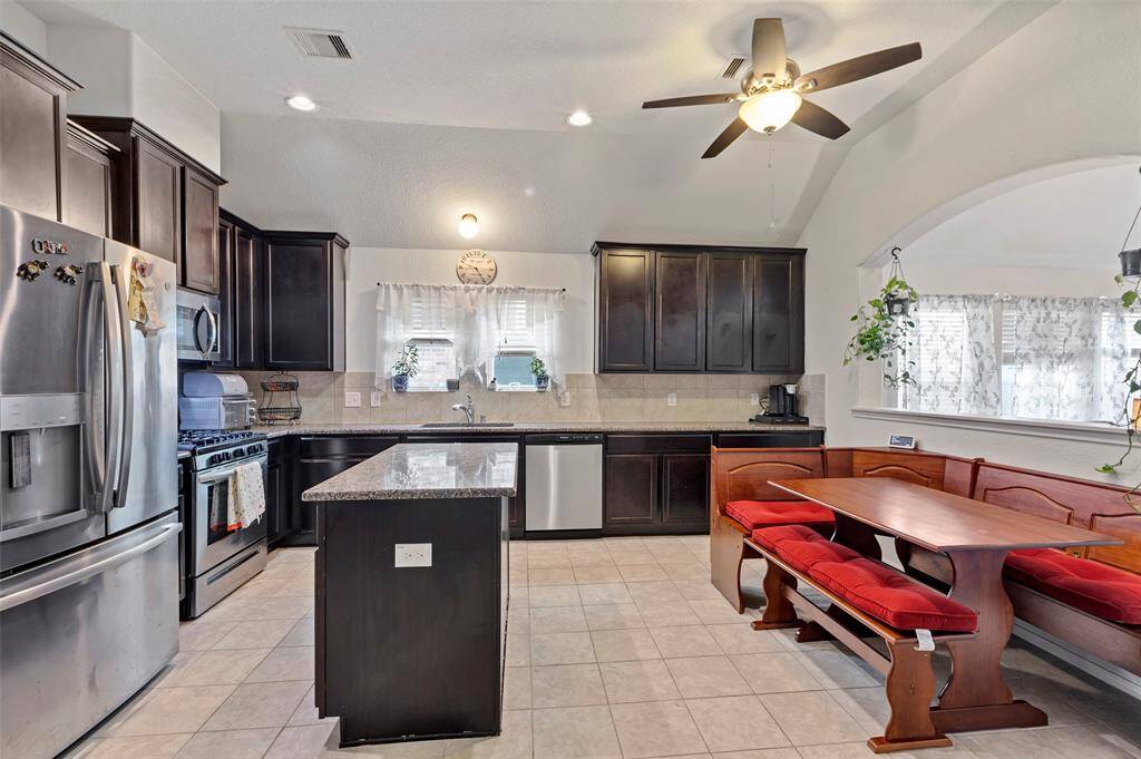 Designed for versatility, this spacious kitchen features a functional island and offers endless possibilities for a setup that suits your family's needs.