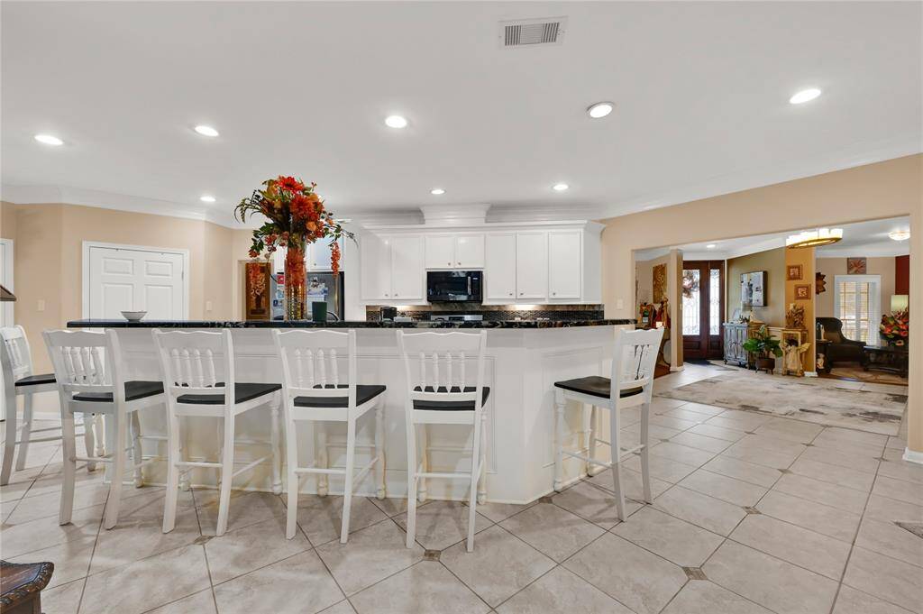 View of kitchen w/ custom cabinets